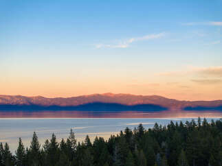 Experience breathtaking sunset views over Lake Tahoe from this stunning property.