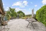 Enjoy outdoor living on this spacious patio, perfect for entertaining or relaxing.