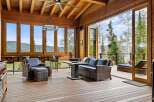 Experience breathtaking mountain views from this stunning covered deck, perfect for indoor-outdoor living.