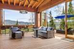 Experience breathtaking mountain views from this stunning covered deck, perfect for entertaining or relaxing.