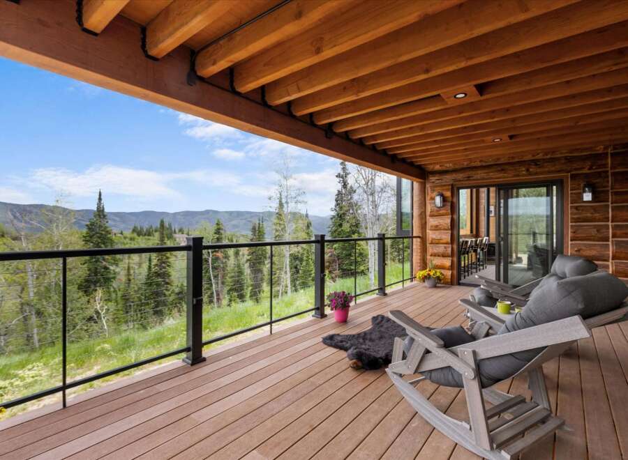 Enjoy breathtaking mountain views from this expansive covered deck, perfect for relaxing or entertaining.