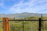 Experience breathtaking mountain views from this stunning property, featuring a modern cable railing system for unobstructed vistas.