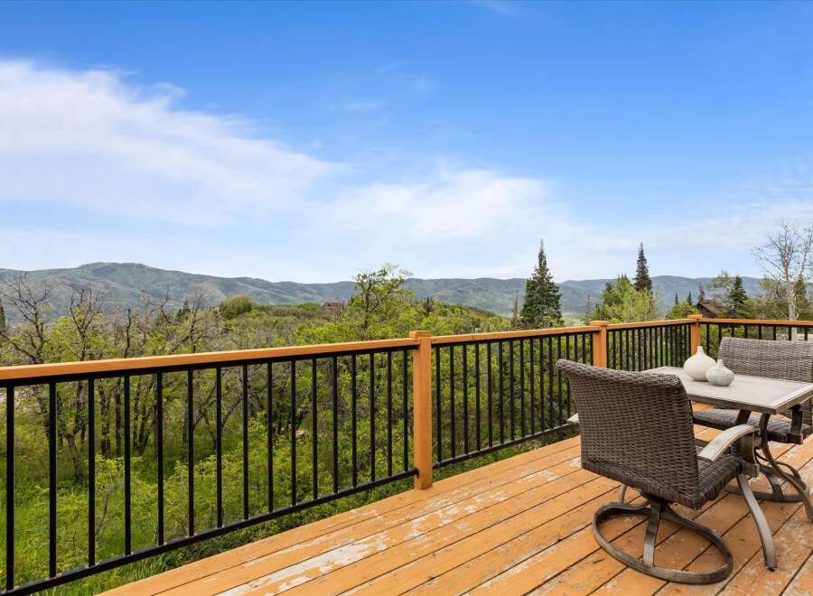 Enjoy breathtaking mountain views from this expansive deck, perfect for outdoor entertaining or quiet relaxation.