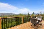 Enjoy breathtaking mountain views from this expansive deck, perfect for outdoor entertaining or quiet relaxation.