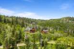 Nestled amidst a lush, verdant forest, this stunning mountain property offers unparalleled privacy and breathtaking natural beauty.