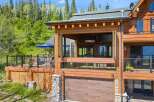 Experience luxury mountain living in this stunning log home, featuring expansive decks and panoramic forest views.