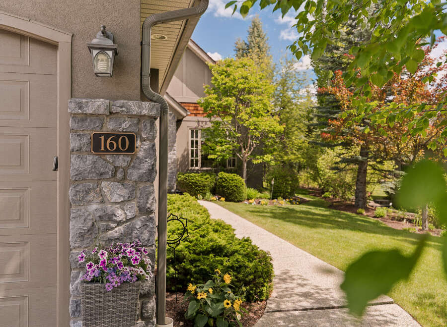 Welcome to this charming property, beautifully situated with a well-maintained lawn and lush landscaping.