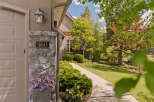 Welcome to this charming property, beautifully situated with a well-maintained lawn and lush landscaping.