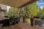 Enjoy outdoor living on this spacious covered deck, perfect for al fresco dining or relaxing amidst nature.