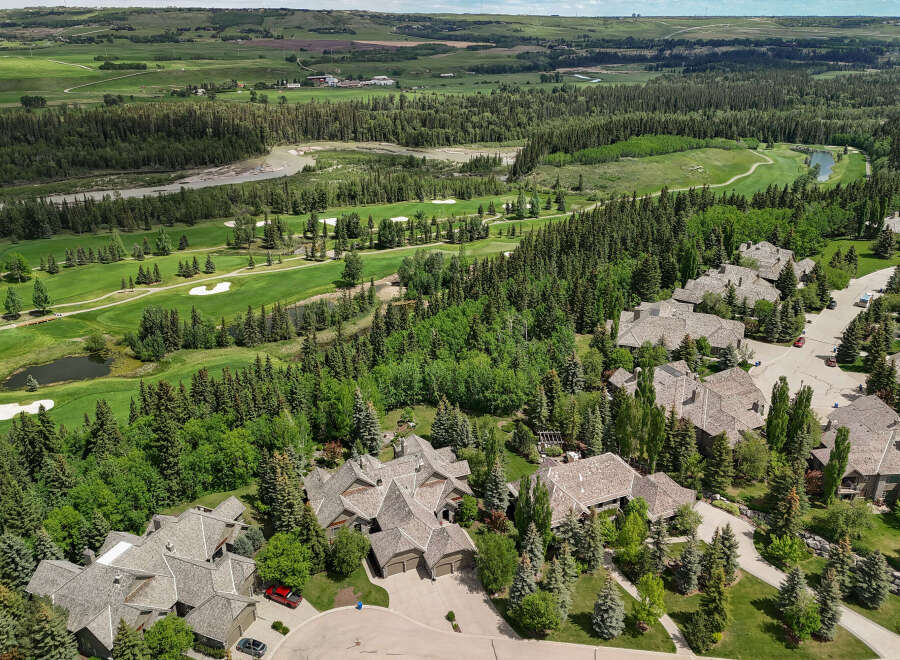 Experience luxury living in this stunning aerial view of a golf course community.