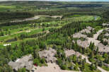Experience luxury living in this stunning aerial view of a golf course community.