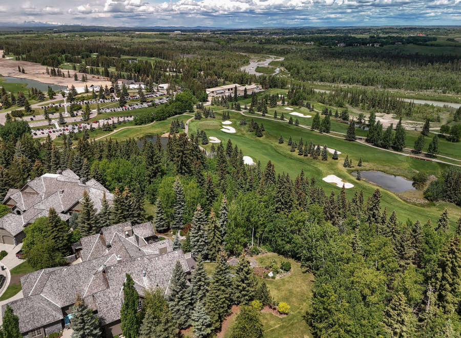 Experience luxury living in this stunning aerial view of a golf course community.