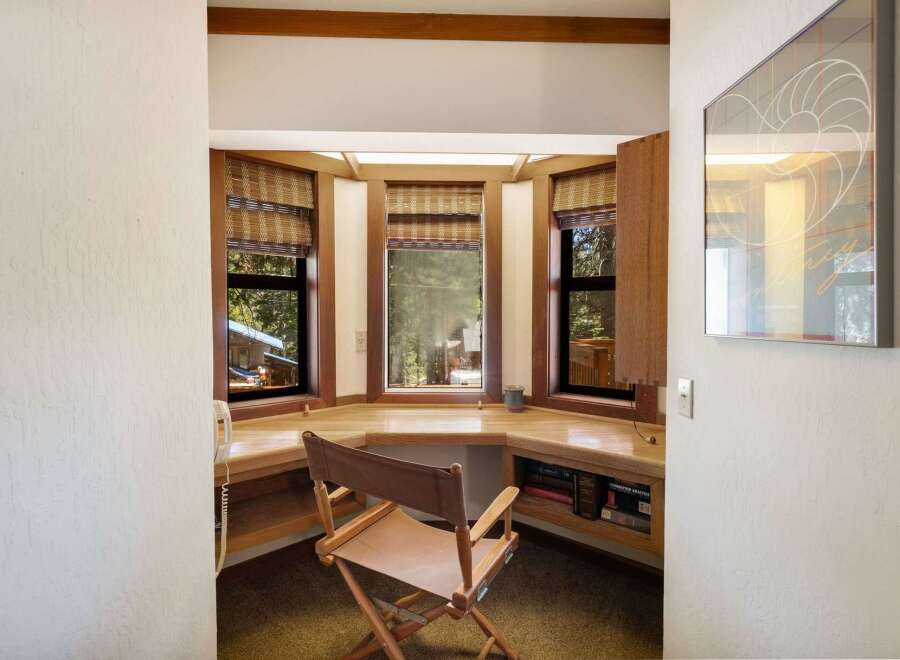 Discover a charming built-in desk area, perfect for a home office or study nook.
