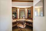 Discover a charming built-in desk area, perfect for a home office or study nook.