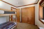 This charming bedroom features a space-saving bunk bed, perfect for accommodating guests or family.