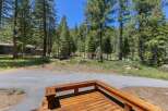 Enjoy the serene mountain lifestyle from this charming property nestled among tall pine trees.