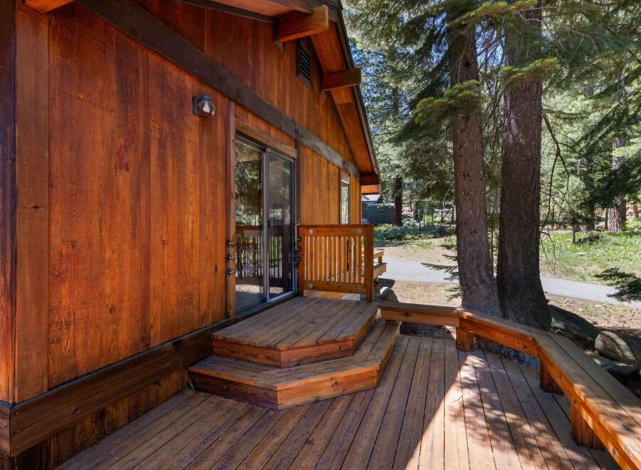 Experience rustic charm with this beautiful wooden cabin, featuring a spacious deck perfect for outdoor relaxation.