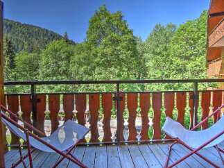Enjoy the serene mountain views from this charming balcony, perfect for your morning coffee or evening relaxation.