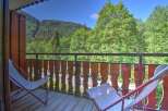 Enjoy the breathtaking mountain views from this charming balcony, perfect for your morning coffee or evening relaxation.