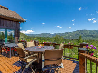 Enjoy breathtaking mountain views from this stunning deck, perfect for entertaining or relaxing.