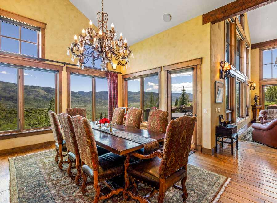 Experience breathtaking mountain views from this elegant dining room, perfect for hosting memorable gatherings.