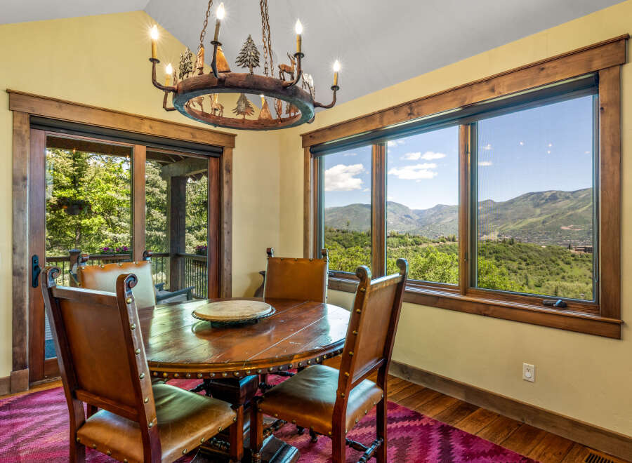 Experience breathtaking mountain views from this charming dining area, perfect for intimate gatherings.