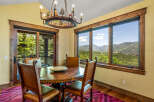 Experience breathtaking mountain views from this charming dining area, perfect for intimate gatherings.