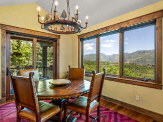 Experience breathtaking mountain views from this charming dining area, perfect for intimate gatherings.