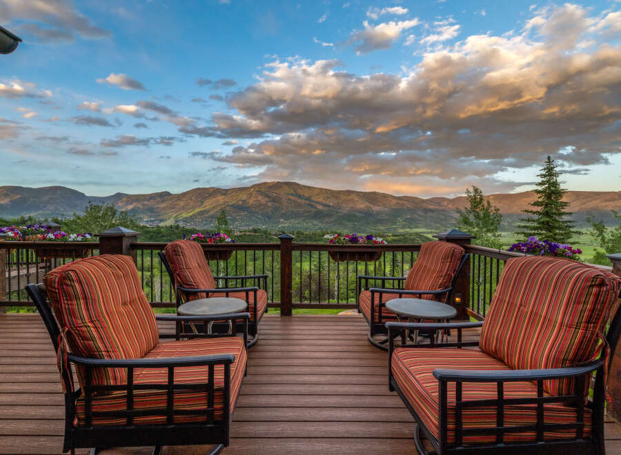 Experience breathtaking mountain views from this stunning deck, perfect for enjoying serene sunsets and crisp morning air.