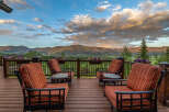 Experience breathtaking mountain views from this stunning deck, perfect for enjoying serene sunsets and crisp morning air.