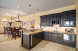 Experience luxury and entertainment in this stunning basement bar and kitchen area.