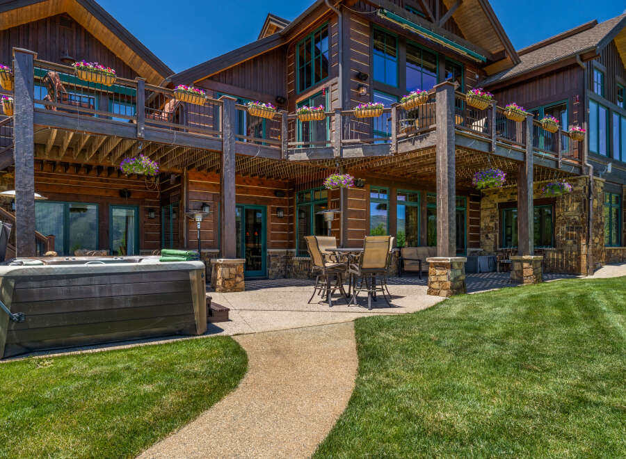 Experience luxury mountain living with this stunning log home, featuring expansive decks and a private hot tub perfect for relaxation.