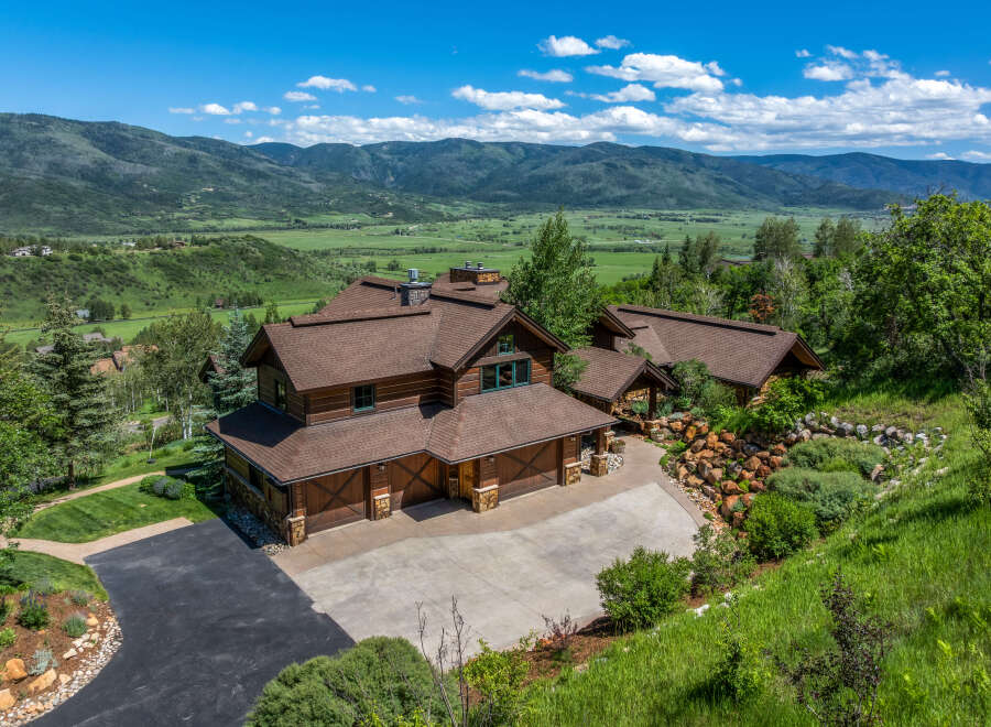 Experience luxury mountain living in this stunning log home, nestled amidst breathtaking natural beauty.