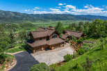 Experience luxury mountain living in this stunning log home, nestled amidst breathtaking natural beauty.