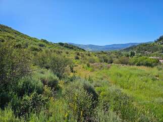 Discover breathtaking mountain views from this stunning property, perfect for building your dream home.