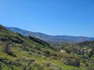 Nestled amidst rolling green hills and majestic mountains, this property offers a serene escape with breathtaking panoramic views.