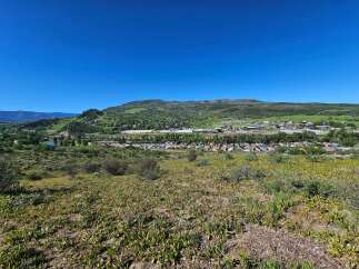 Discover this charming town nestled in a picturesque valley, offering a serene lifestyle with stunning mountain views.