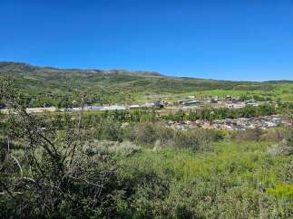 Discover this charming town nestled in a picturesque valley, offering a serene lifestyle with stunning mountain views.