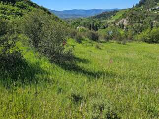Discover this stunning property with breathtaking panoramic views of rolling hills and distant mountains.