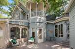Enjoy outdoor living on this charming deck, complete with comfortable seating and a small table, perfect for morning coffee or evening relaxation.