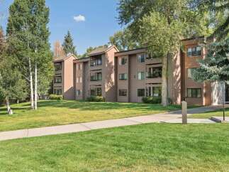 Discover comfortable living in this charming apartment complex, nestled amidst lush greenery and mature trees.