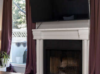 Experience cozy evenings by this elegant fireplace, perfect for gathering with loved ones.