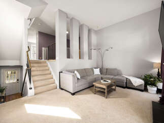 Step into this inviting living room featuring a spacious sectional sofa perfect for gatherings and a stylish coffee table.