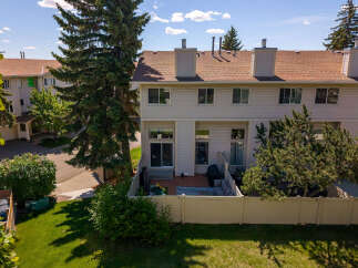 Enjoy outdoor living in this charming townhouse featuring a private backyard patio perfect for entertaining.