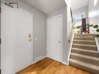 Step into this welcoming entryway featuring a bright and airy atmosphere.