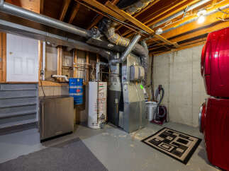 Discover the practical side of this home with its well-equipped basement, featuring a high-efficiency furnace and water heater for optimal comfort and energy savings.