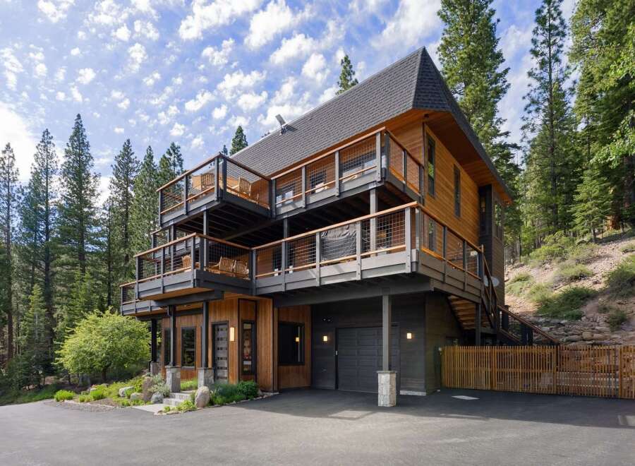 Experience modern mountain living in this stunning multi-level home, nestled amongst towering pine trees.
