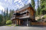 Experience modern mountain living in this stunning multi-level home, nestled amongst towering pine trees.