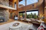 Experience breathtaking mountain views from this stunning contemporary home, featuring expansive windows and a spacious open-concept living area.