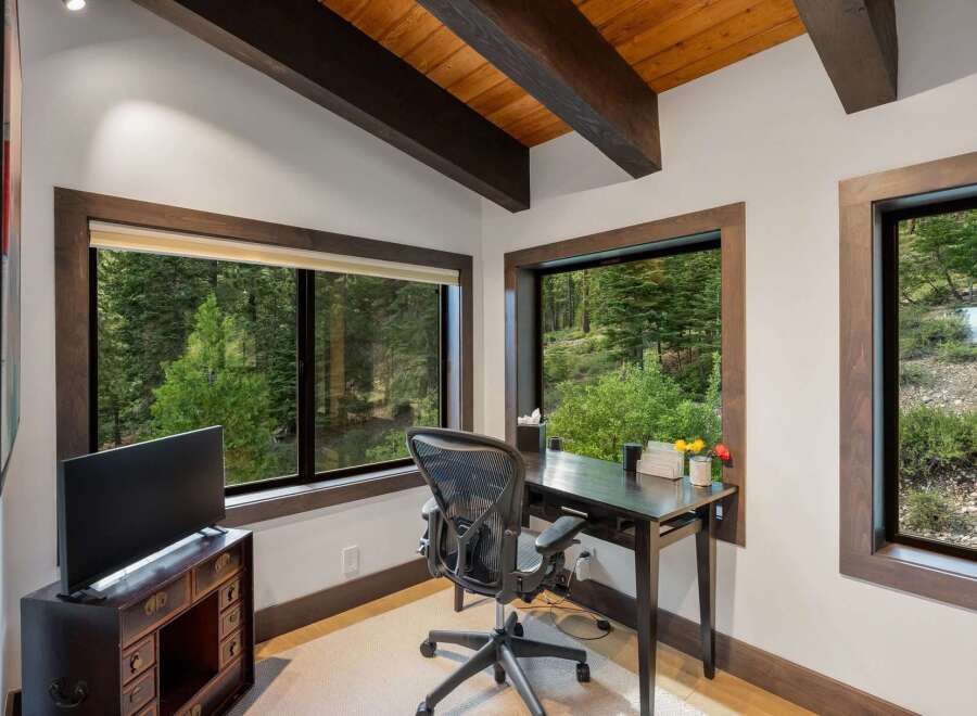 This home office features a modern desk and ergonomic chair, perfect for productive workdays.